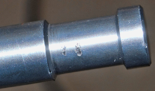 Picture of grooves left in soft aluminum of Kupo 4-way clamp stud, as a result of mounting a Bogen Calumet Travelite 750r by Peter Free for his review of the Kupo clamp and stud.